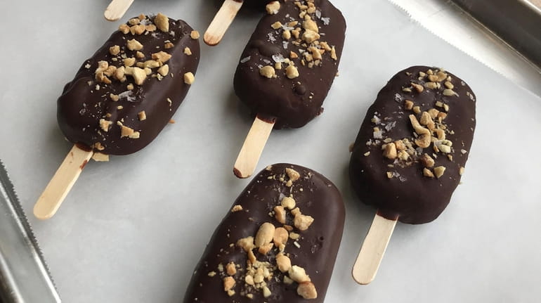 Chocolate-dipped ice cream bars from Sweet Soul Bakery in St....