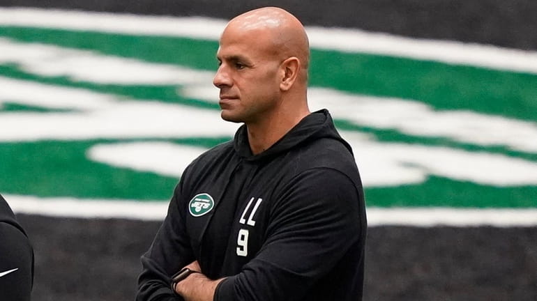 New York Jets head coach Robert Saleh, right, watches his players...