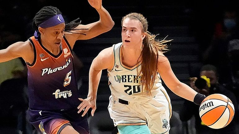 Liberty guard Sabrina Ionescu brings the ball upcourt against Mercury...