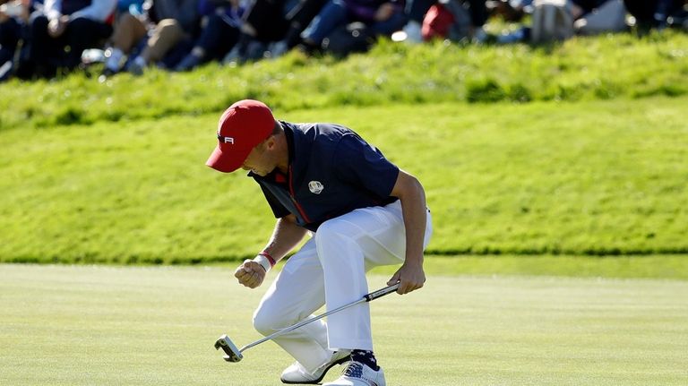 Justin Thomas of the U.S. celebrates after winning the 8th...