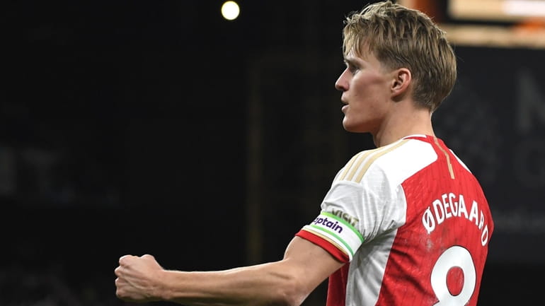 Arsenal's Martin Odegaard celebrates after scoring his side's second goal...