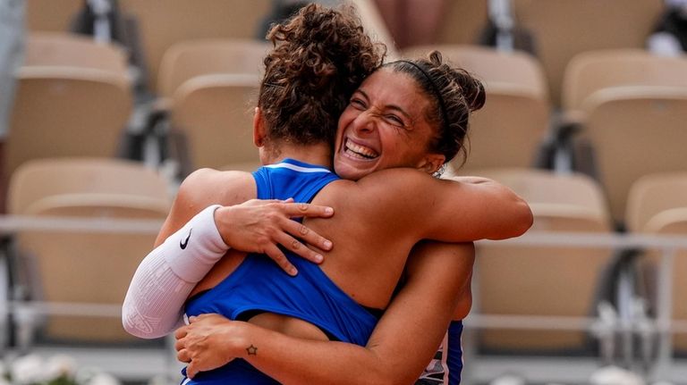 Sara Errani and Jasmine Paolini of Italy celebrate their victory...