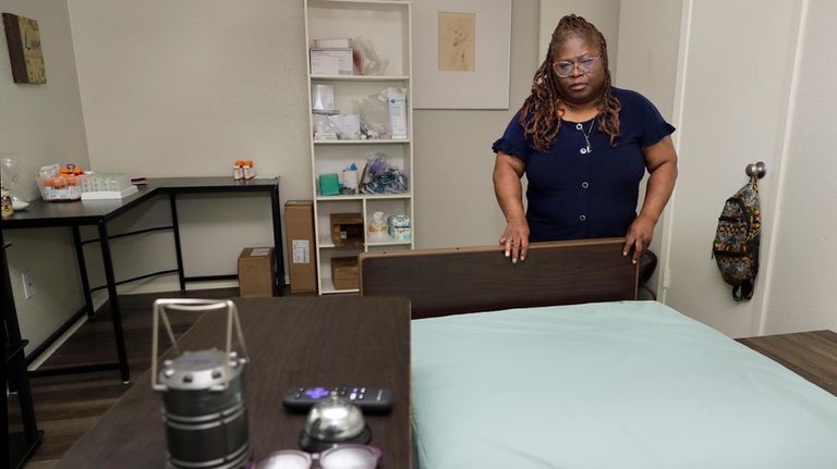 Janet Jarrett in the bedroom of her sister, Pamela Jarrett,...