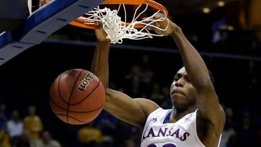 Kansas' Andrew Wiggins dunk during the second half of a...