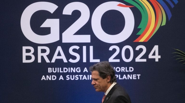 Brazilian Economy Minister Fernando Haddad attends a press conference to...