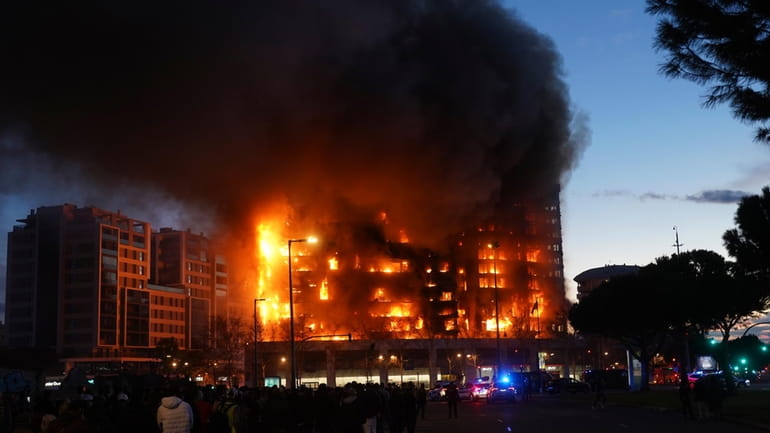 A housing block burns in Valencia, Spain, Thursday, Feb. 22,...