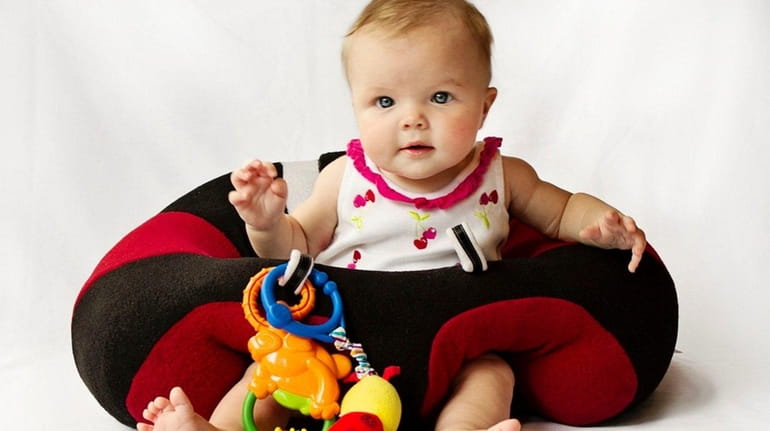 The Hugaboo Baby Seat comes with two toy attachments; $59.99...