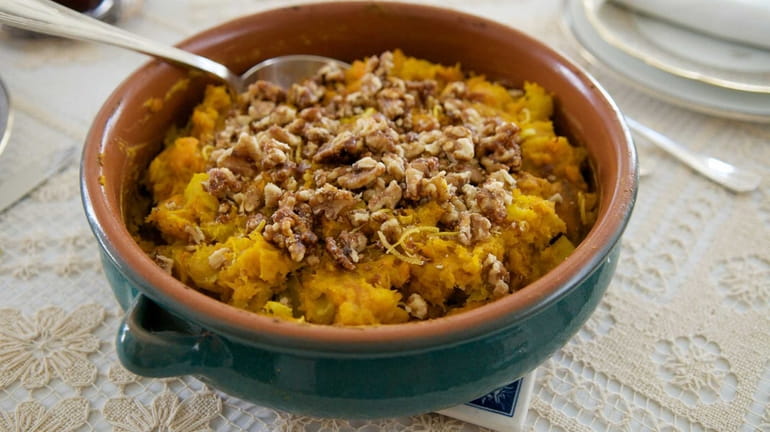 Smashed winter squash and sweet potato with candied walnuts and...