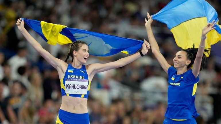 Gold medalist Yaroslava Mahuchikh, and bronze medalist Iryna Gerashchenko, both...