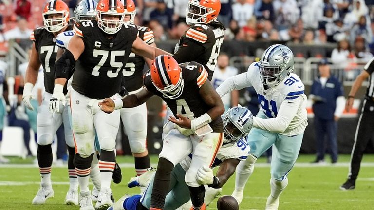 Cleveland Browns quarterback Deshaun Watson (4) has the ball stripped...