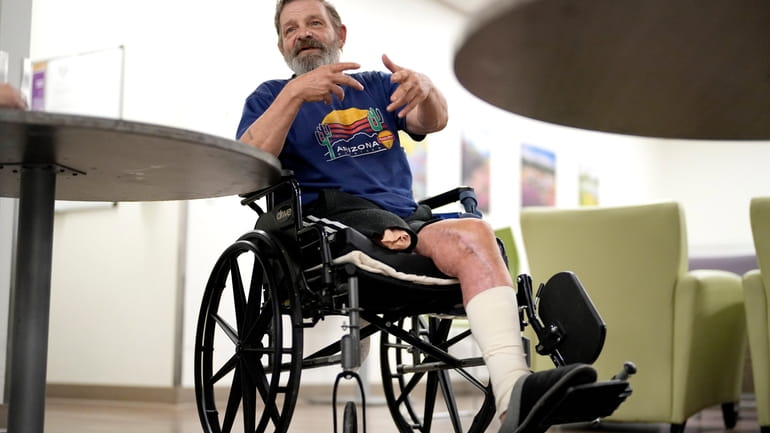 Ron Falk, 62, speaks of losing his leg, Tuesday, June...