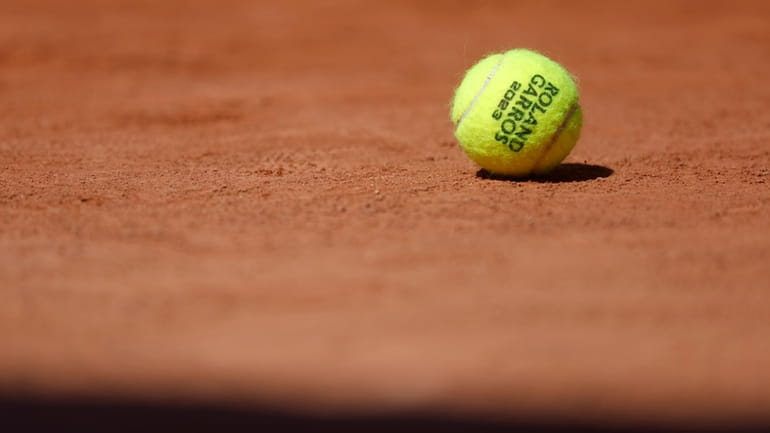 A ball rests on the court of the French Open...