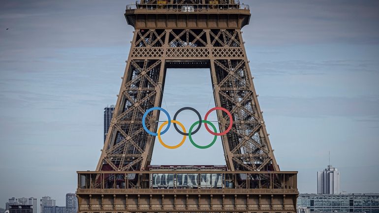 The Olympic rings are seen on the Eiffel Tower, Sunday,...