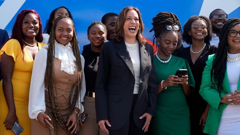 Democratic presidential nominee Vice President Kamala Harris pose for a...