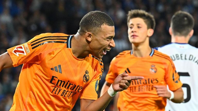 Real Madrid's Kylian Mbappe celebrates after scoring his side's second...