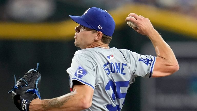 Los Angeles Dodgers starting pitcher Gavin Stone throws against the...