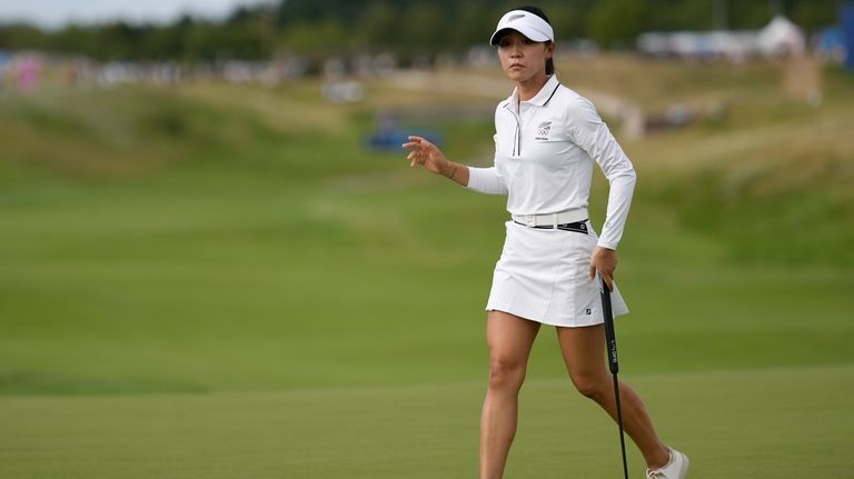 Lydia Ko, of New Zealand, acknowledges the crowd after after...