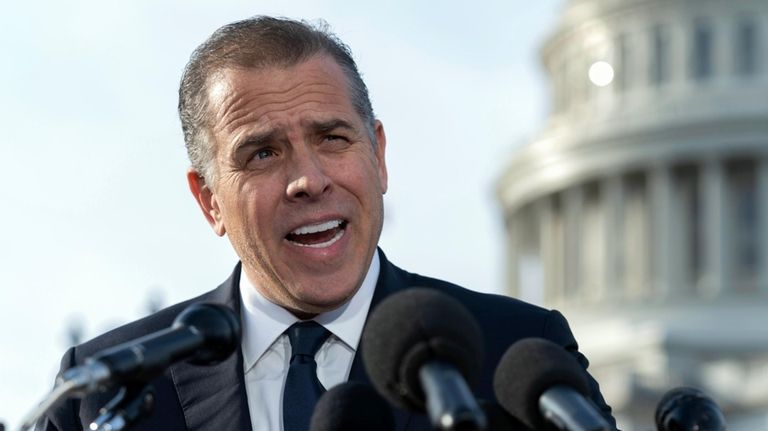 Hunter Biden, son of President Joe Biden, talks to reporters...