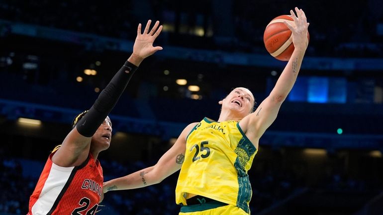 Australia's Lauren Jackson, right, reached for a rebound along with...