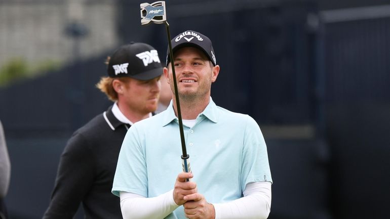 Sam Hutsby of England reacts after missing a putt on...