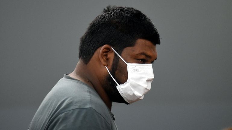 Andrew Ramsaroop, of Queeens, during his arraignment in Central Islip...