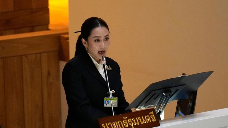 Thailand's Prime Minister Paetongtarn Shinawatra reads the policy statement at...