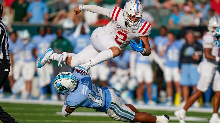 Mississippi quarterback Jaxson Dart (2) carries for a first down...