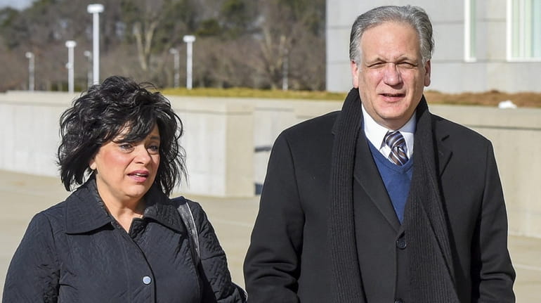 Linda and Edward and Mangano arrive at federal court in Central...