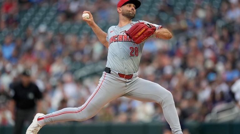 Cincinnati Reds starting pitcher Nick Martinez (28) delivers during the...