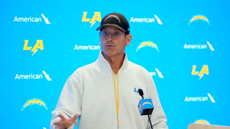 Los Angeles Chargers head coach Jim Harbaugh speaks at a...