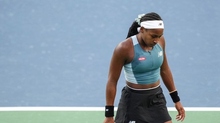 Coco Gauff of the United States reacts during her loss...