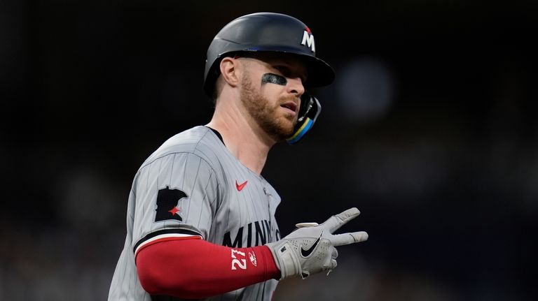 Minnesota Twins' Ryan Jeffers celebrates after hitting a two-run home...