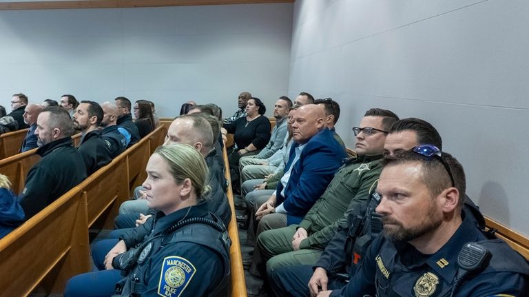 Law enforcement sit at the trial of Adam Montgomery at...