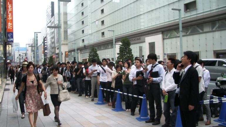 The lines queued down the block in the Ginza shopping...