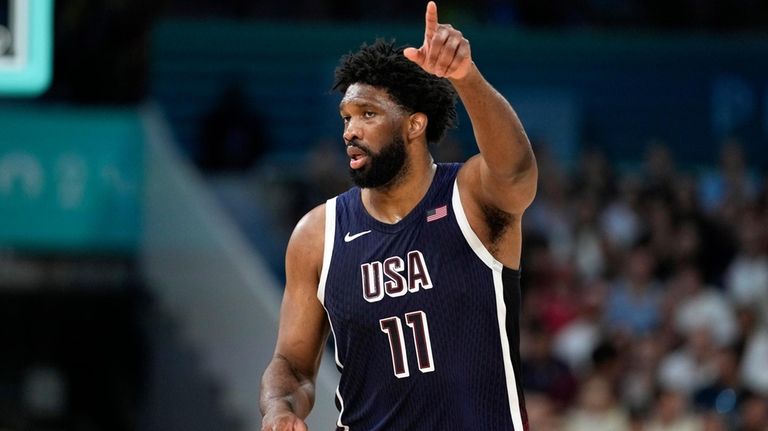 United States' Joel Embiid gestures after scoring during a men's...