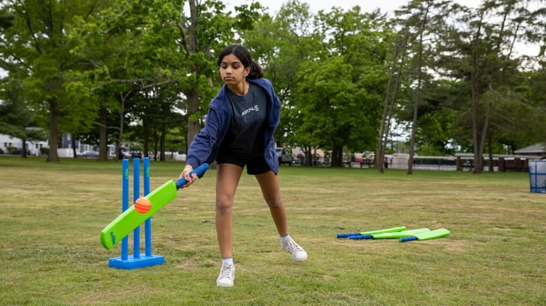 Danika Gowda, 13, of Levittown, practices hitting the ball at...