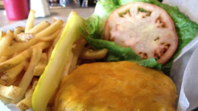 A burger at Croxley Ales in Farmingdale is garnished with...