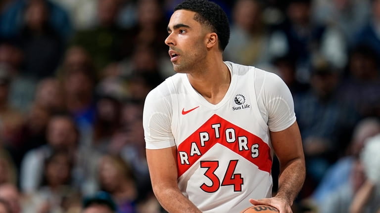 Toronto Raptors center Jontay Porter (34) looks to pass in...