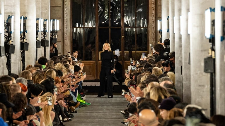 Designer Tory Burch acknowledges the crowd after her fall/winter 2024...