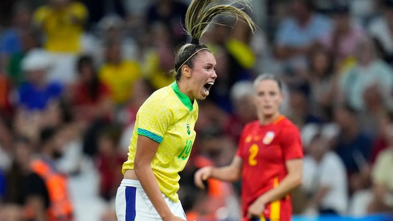 Brazil's Priscila reacts after missing an opportunity to score during...