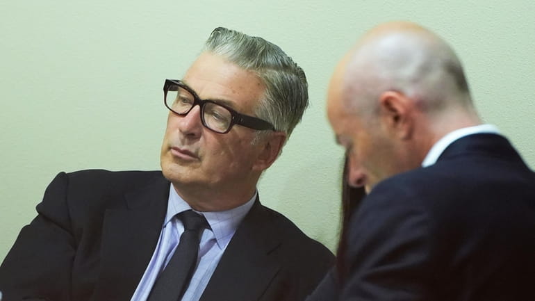 Actor Alec Baldwin, left, attends his trial for involuntary manslaughter...