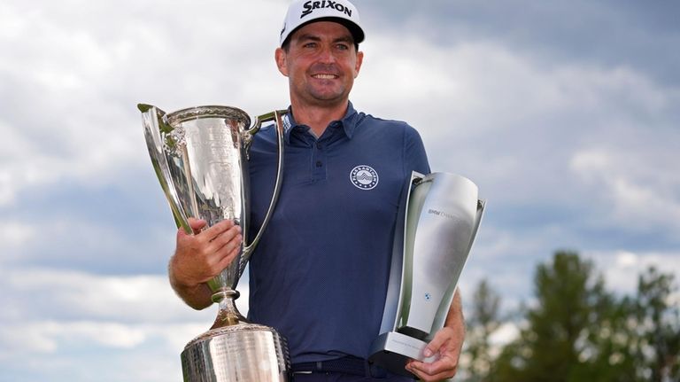 Keegan Bradley holds up the BMW Championship and J.K. Wadley...