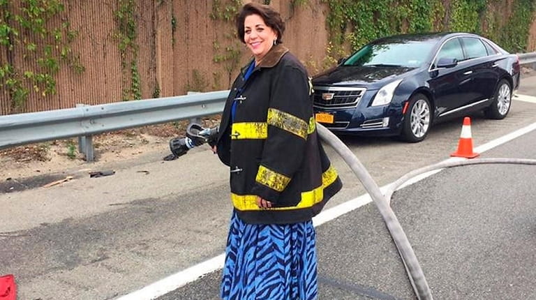 Roseanne Kleppsattel, a member of the Kings Park Fire Department,...