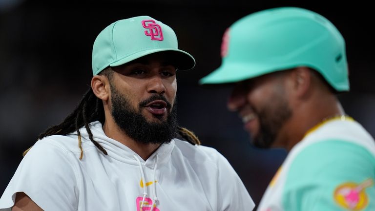 San Diego Padres's Fernando Tatis Jr., celebrates in the dugout...