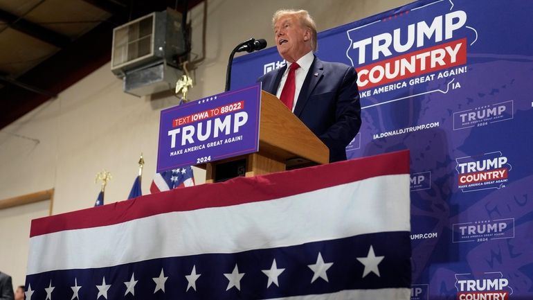 Former President Donald Trump speaks during a commit to caucus...