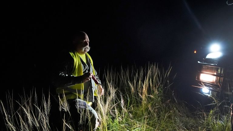 Thomas Aycock, a contractor with the Florida Fish and Wildlife...