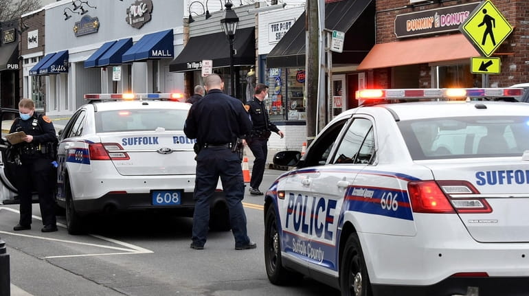 Suffolk police at the scene in Port Jefferson Wednesday afternoon where...