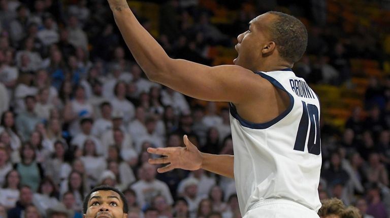 Utah State guard Darius Brown II (10) drives to the...