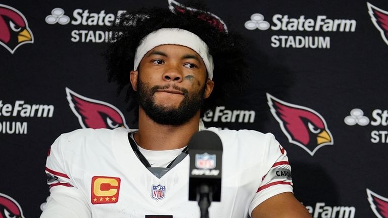 Arizona Cardinals quarterback Kyler Murray pauses before answering a question...