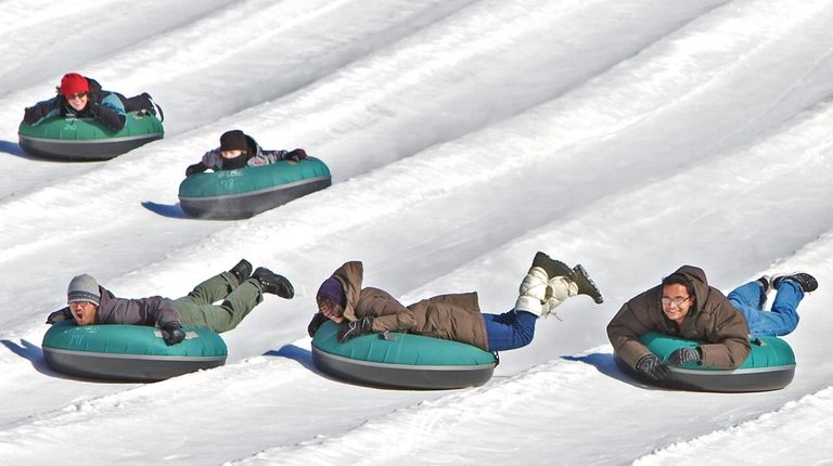 Snow tubing is an easy way to slide downhill in...